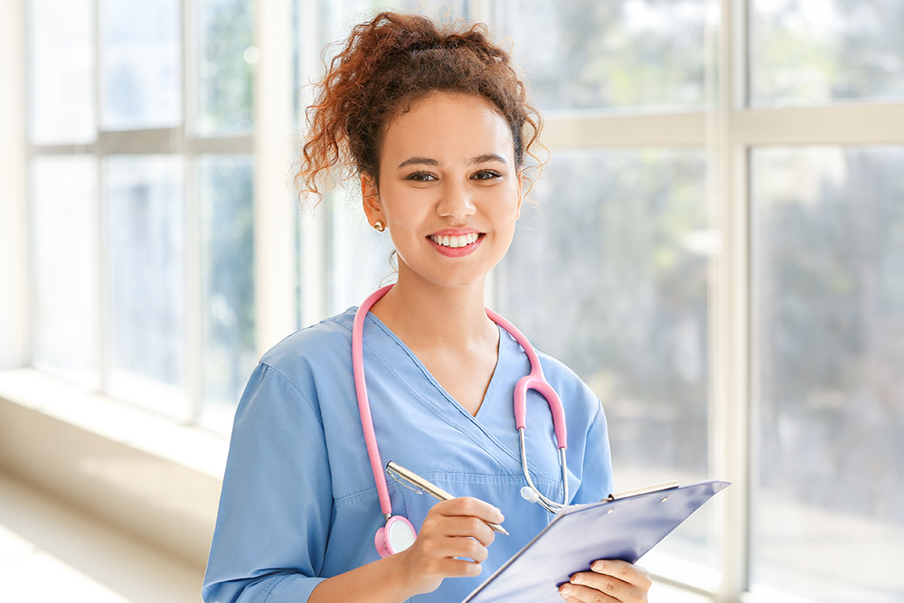 Young African-American nurse in clinic