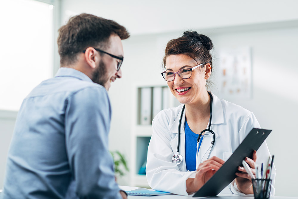 Doctor and patient sitting in doctor's office