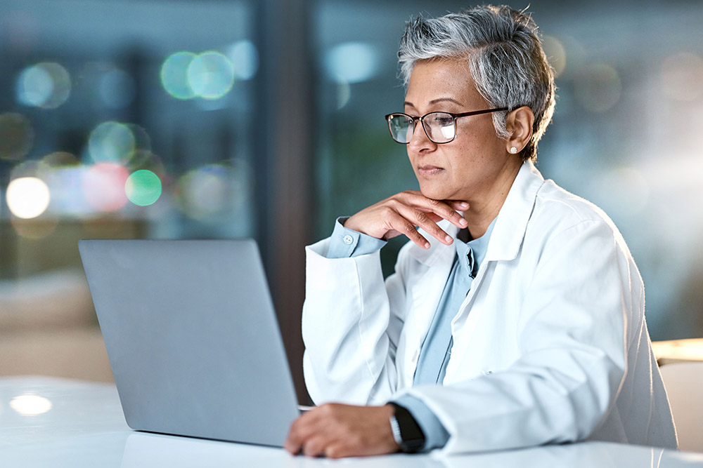 doctor working on laptop computer