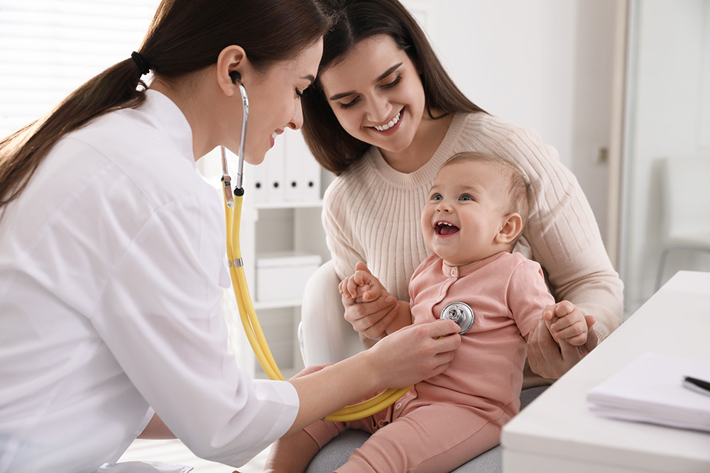 Mother with her cute baby visiting pediatrician in clinic